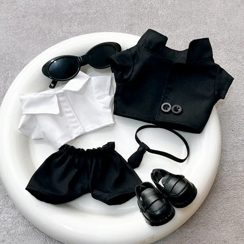 Black suit set for dolls with oval sunglasses and ankle boots, polyester material.