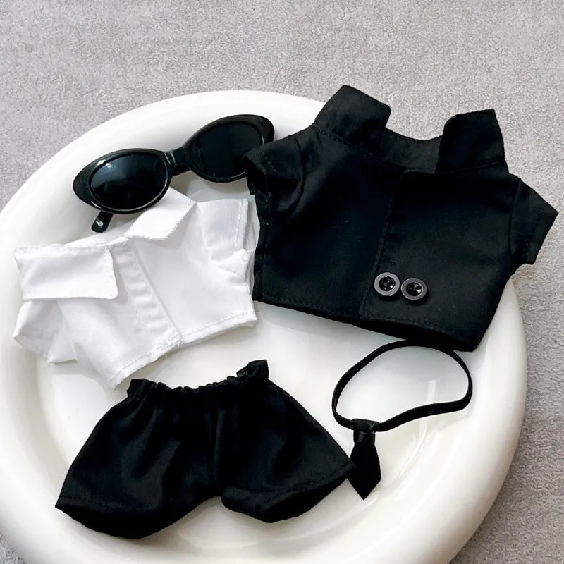 Black suit set for dolls with oval sunglasses and ankle boots, polyester material.