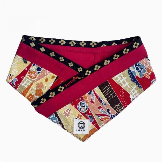 Japanese style pet scarf bib with red diamond pattern and tassels on a light background
