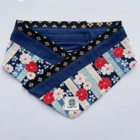 Japanese style pet scarf bib with red diamond pattern and tassels on a light background