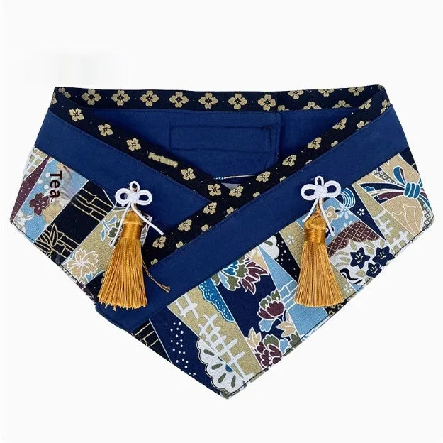 Japanese style pet scarf bib with red diamond pattern and tassels on a light background