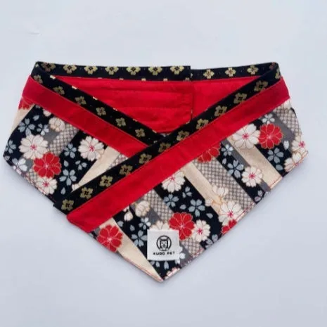 Japanese style pet scarf bib with red diamond pattern and tassels on a light background