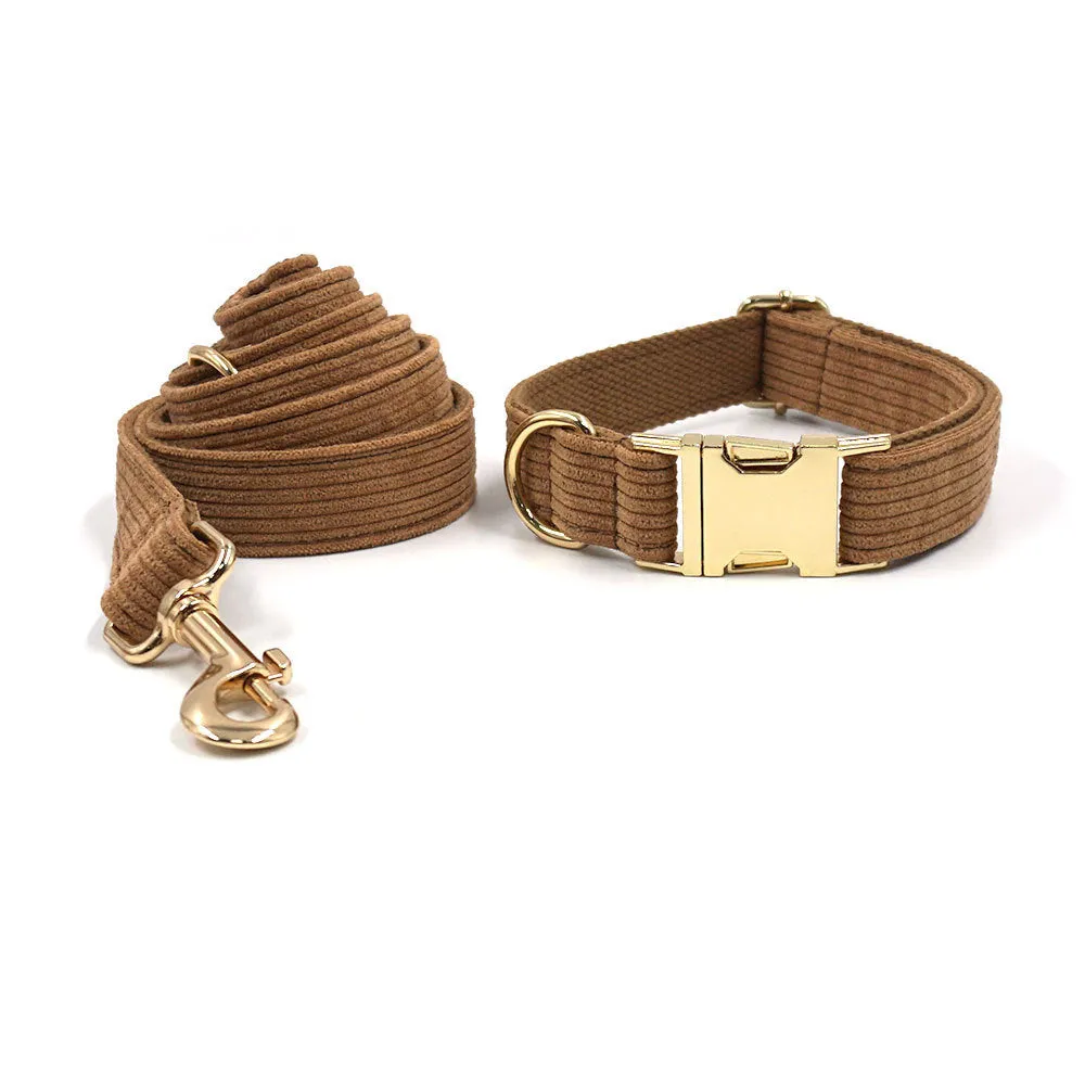 Brown corduroy dog collar and harness set with gold buckle and matching bow on a white background