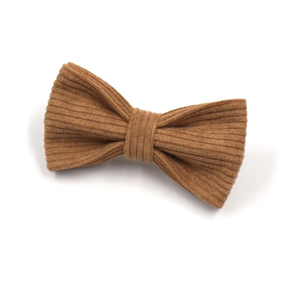 Brown corduroy dog collar and harness set with gold buckle and matching bow on a white background