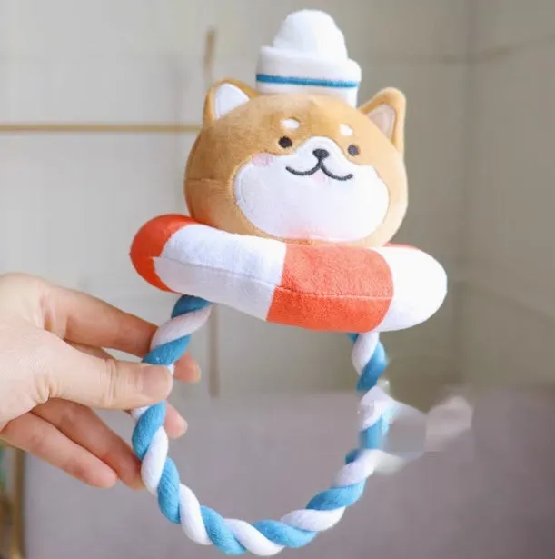Plush dog toys in Xiaojiu butt, seal, whale, dolphin, and Shiba Inu shapes on a light background