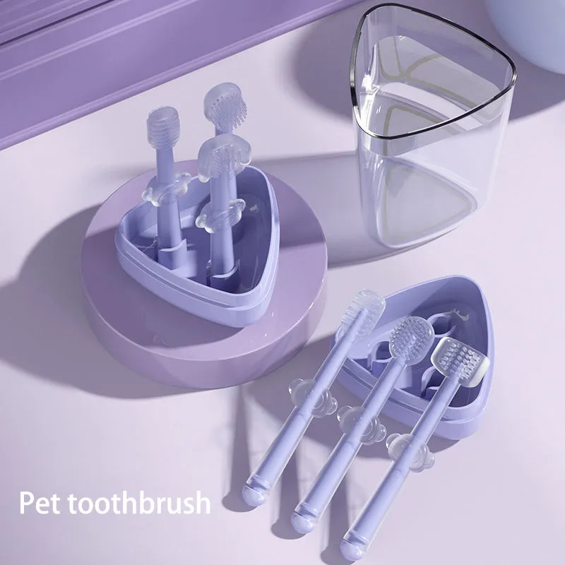 Blue, green, and purple pet toothbrushes with soft silicone bristle heads for dogs and cats.