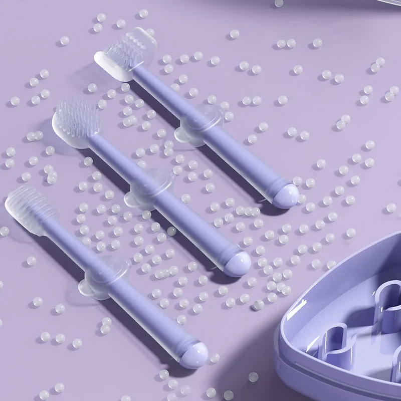 Blue, green, and purple pet toothbrushes with soft silicone bristle heads for dogs and cats.