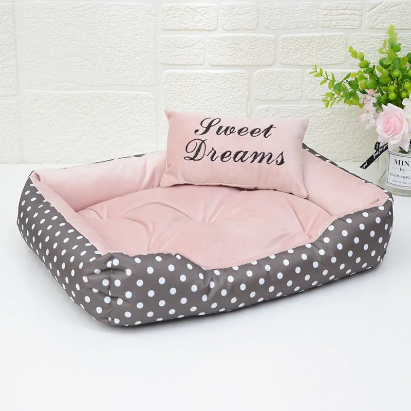Polka dot print square nest dog bed with matching embroidered cushion in grey, blue, pink, or red.