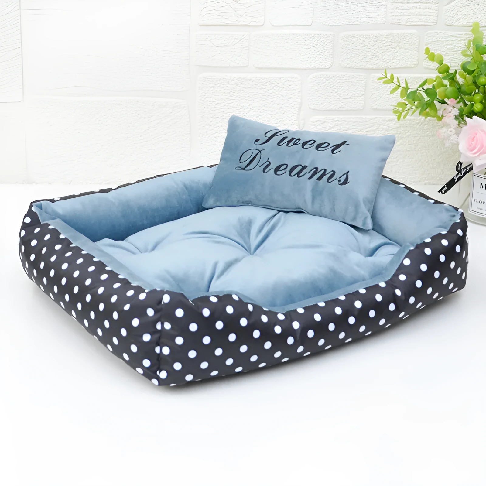 Polka dot print square nest dog bed with matching embroidered cushion in grey, blue, pink, or red.