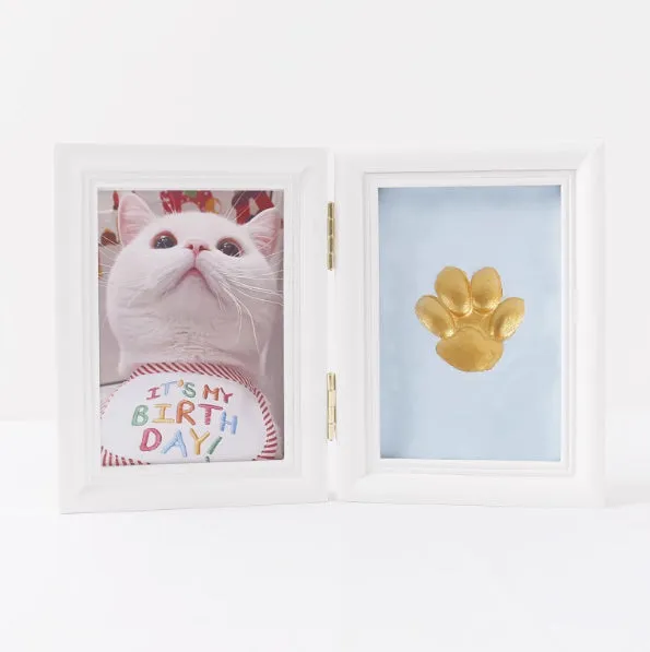 Solid wood cat palm print photo frame with gold lacquer and seal paste kit on table