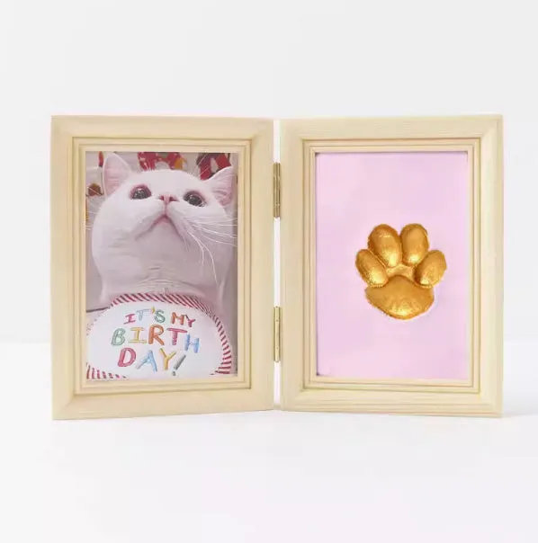 Solid wood cat palm print photo frame with gold lacquer and seal paste kit on table