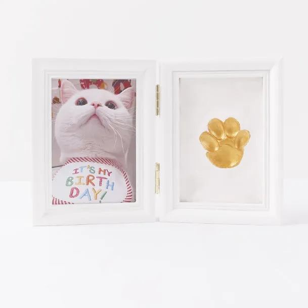 Solid wood cat palm print photo frame with gold lacquer and seal paste kit on table