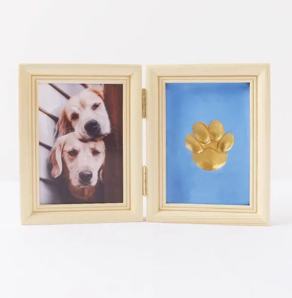 Solid wood cat palm print photo frame with gold lacquer and seal paste kit on table