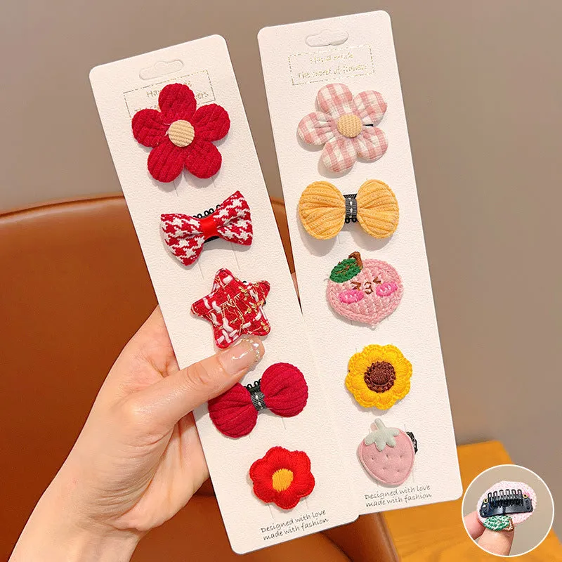 Red and pink plaid plastic cartoon mini dog hairpin sets on a light background