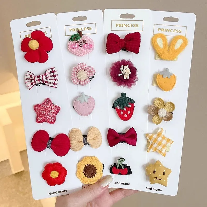 Red and pink plaid plastic cartoon mini dog hairpin sets on a light background