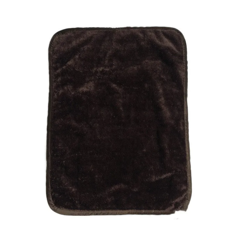 Waterproof urine proof pet blanket in grey with black and white bottom on a kennel bed