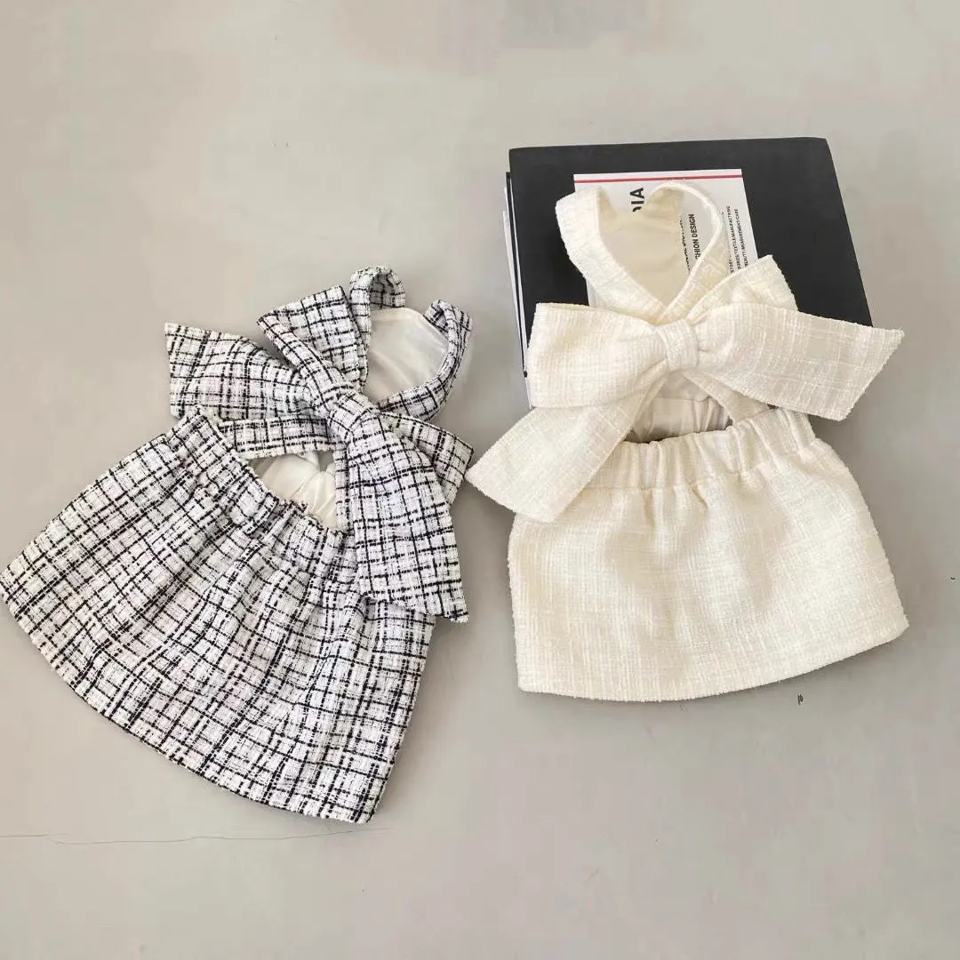 Cotton sling skirt dog pet clothing in black and white pattern on a small dog