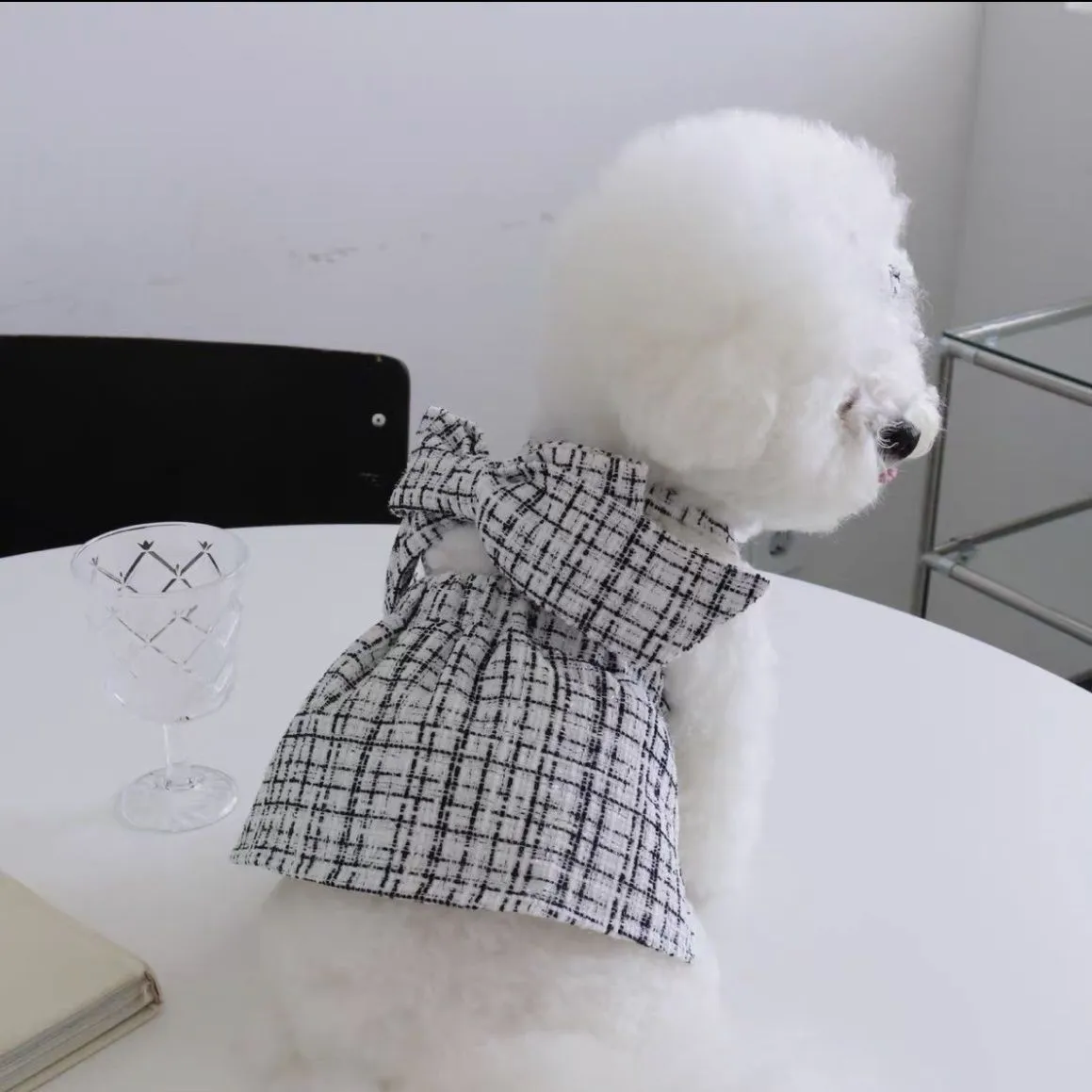 Cotton sling skirt dog pet clothing in black and white pattern on a small dog
