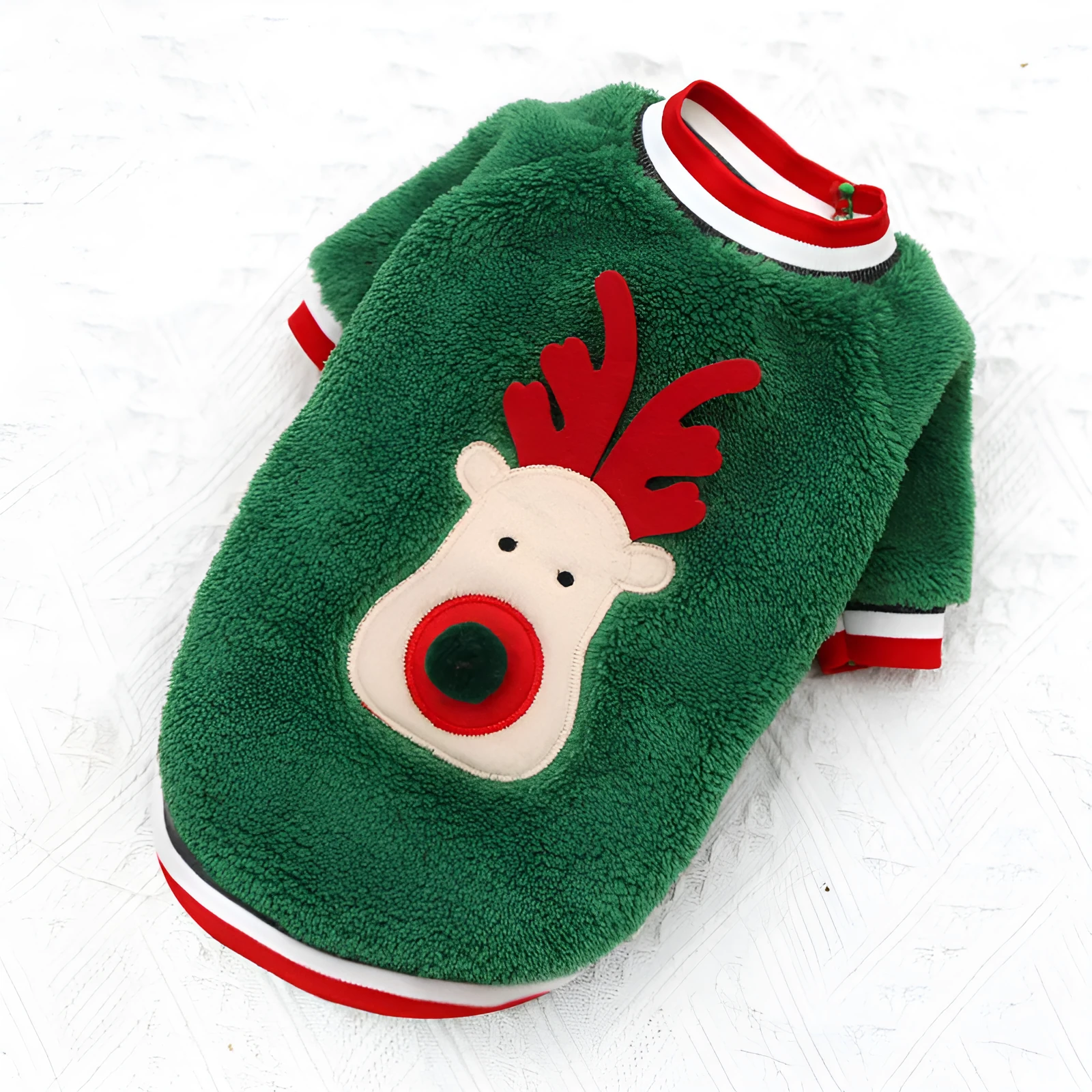 Red coral fleece dog sweater with reindeer hoodie on a small dog over a festive background