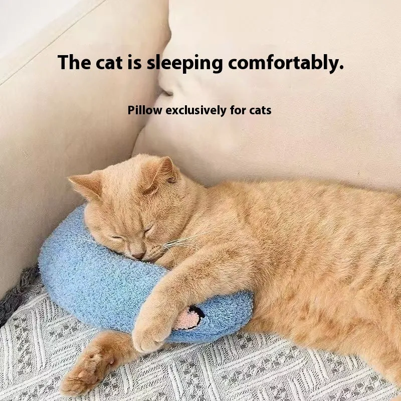 Blue U-shaped cat sleeping mat with integrated moon-shaped neck pillow on a wooden floor.