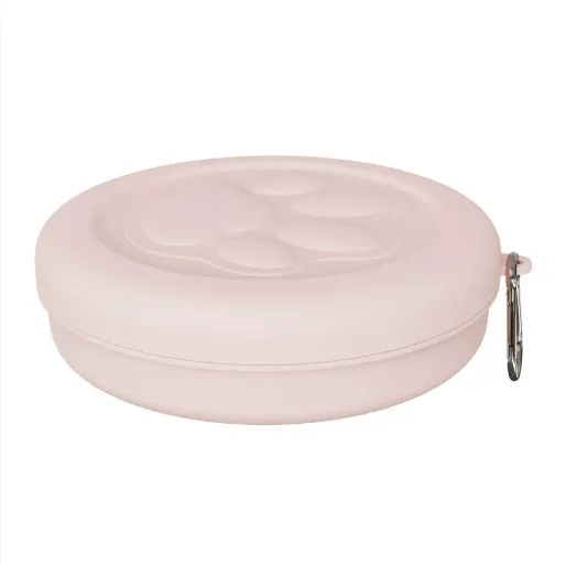Portable dog feeding bowl with a removable silicone base in pink and green colour options.