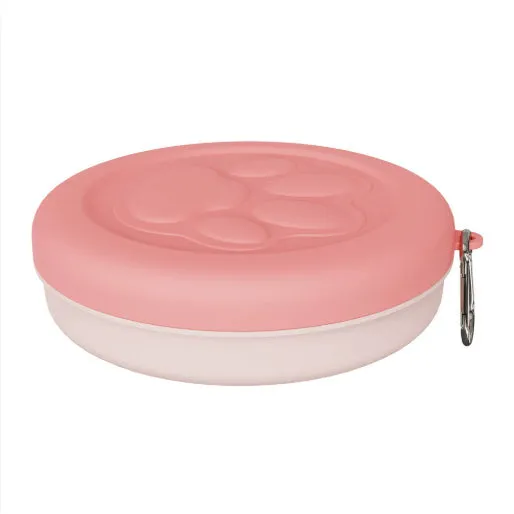 Portable dog feeding bowl with a removable silicone base in pink and green colour options.
