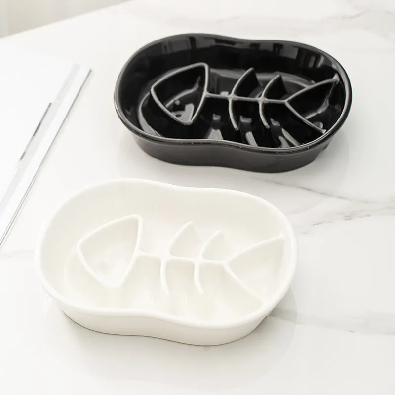 Ceramic shallow cat bowl in black on a light background, showing wide lip and low profile for whisker comfort