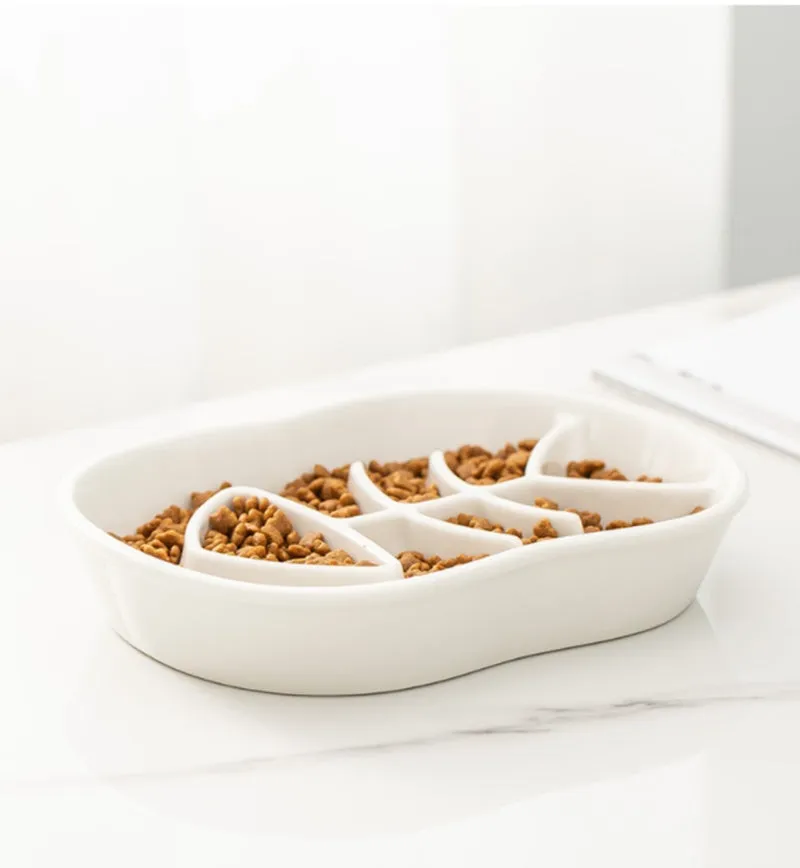 Ceramic shallow cat bowl in black on a light background, showing wide lip and low profile for whisker comfort
