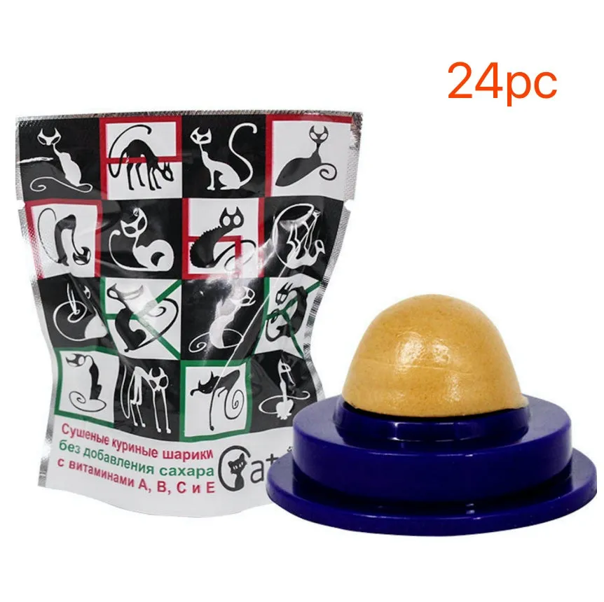 Green and blue pet cat sugar energy ball with catnip and gold fish gelatin on a floor
