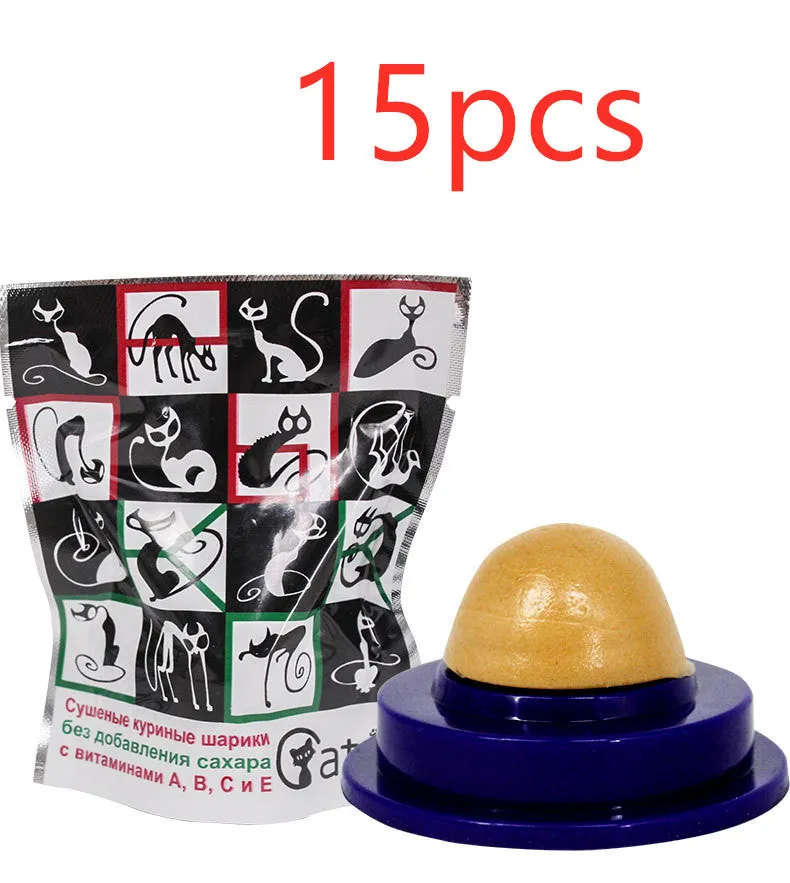Green and blue pet cat sugar energy ball with catnip and gold fish gelatin on a floor