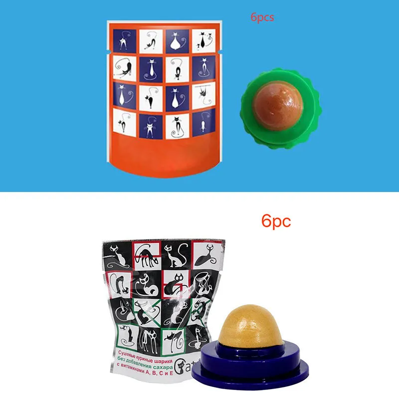 Green and blue pet cat sugar energy ball with catnip and gold fish gelatin on a floor