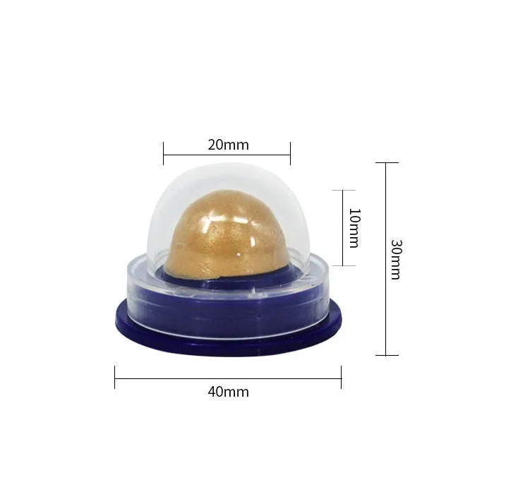 Green and blue pet cat sugar energy ball with catnip and gold fish gelatin on a floor