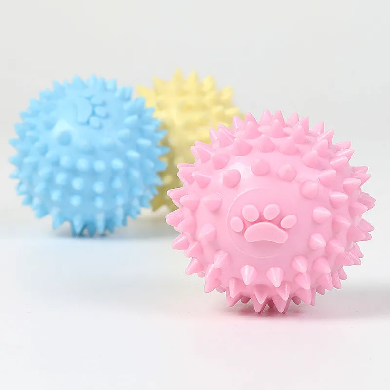Blue TPR dog chewing ball with textured footprint design for teeth cleaning, 6cm diameter
