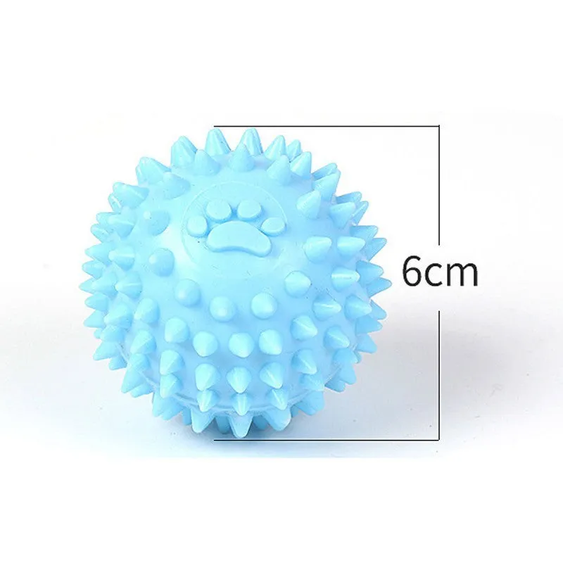 Blue TPR dog chewing ball with textured footprint design for teeth cleaning, 6cm diameter