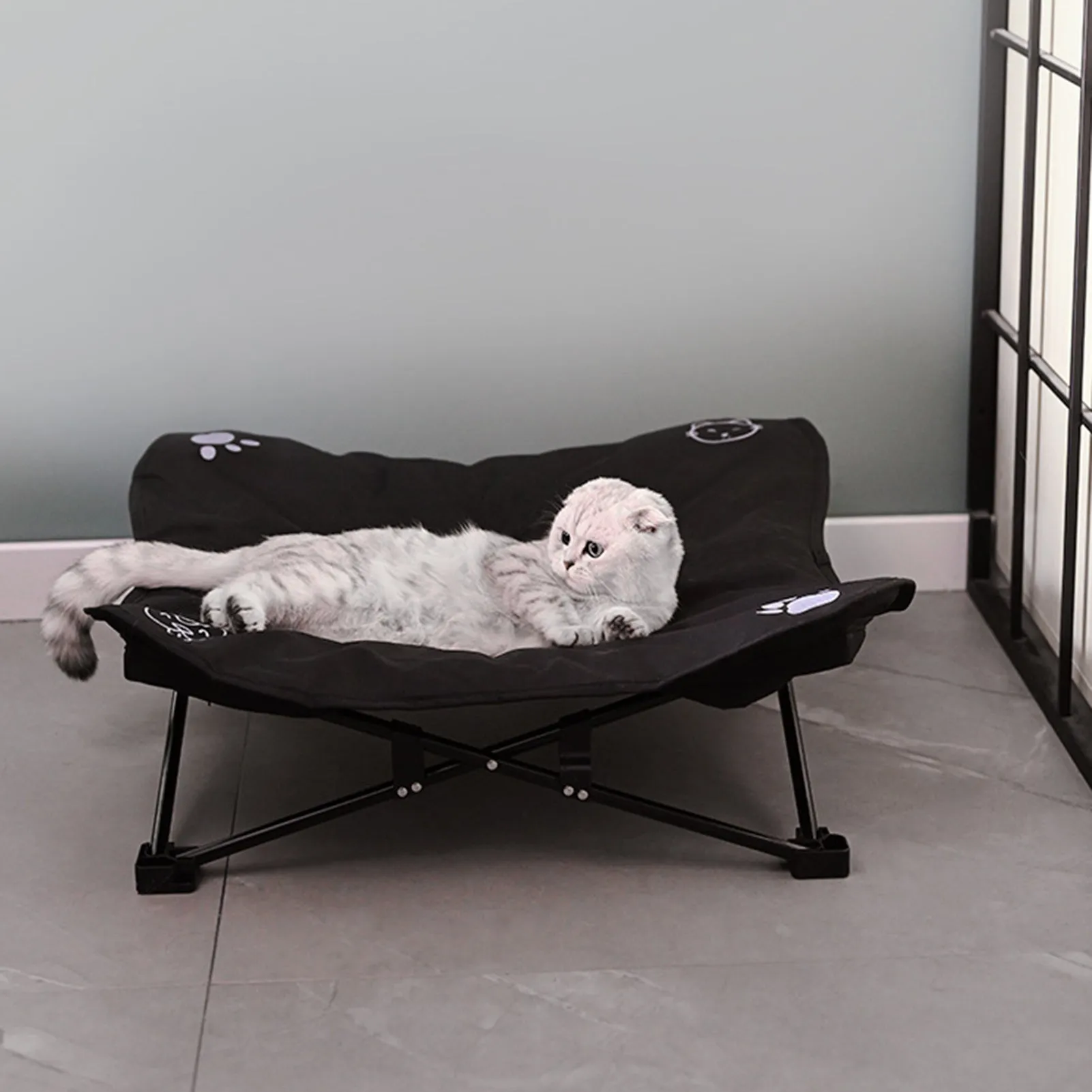 Outdoor pet folding bed with aluminium alloy X-frame and black 600D Oxford cloth sleeping surface