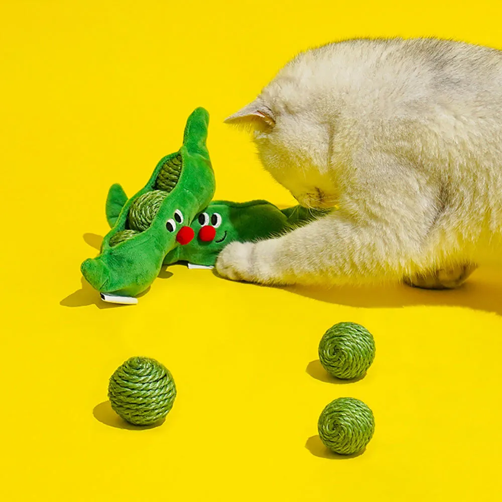 Three green sisal rope cat toy balls with rustling soundstone next to pea pod storage bag