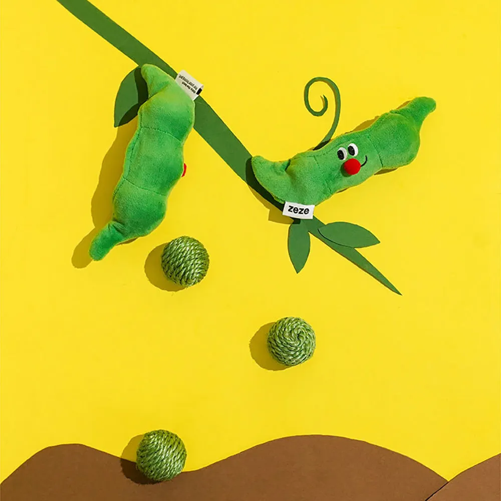 Three green sisal rope cat toy balls with rustling soundstone next to pea pod storage bag