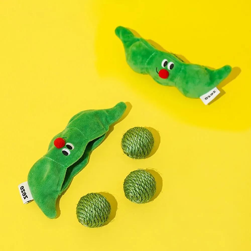 Three green sisal rope cat toy balls with rustling soundstone next to pea pod storage bag