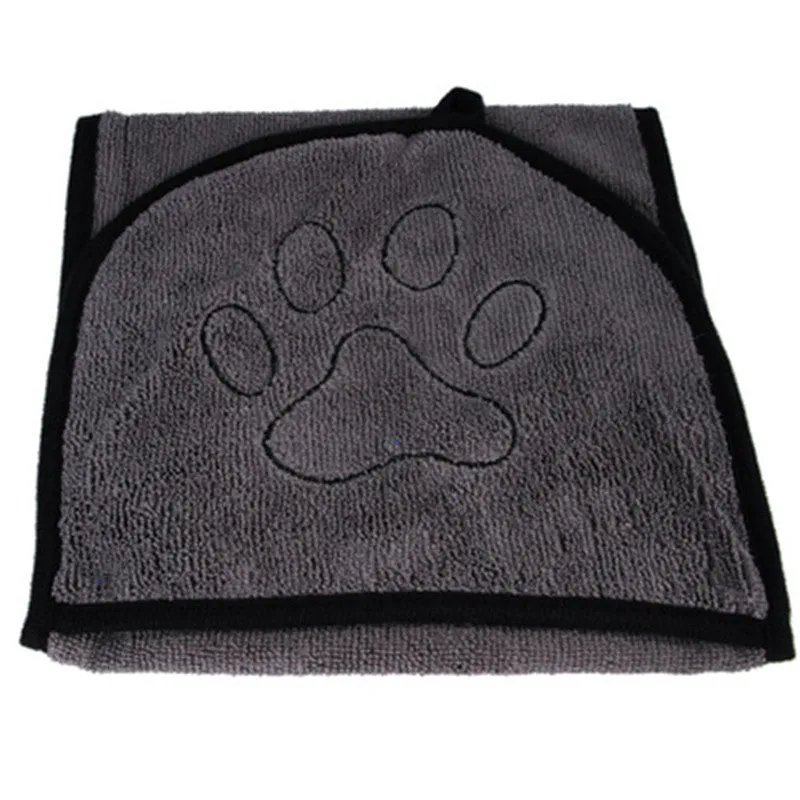 Pet absorbent dog bath towel in blue, green, and grey plain design drying a dog after bath