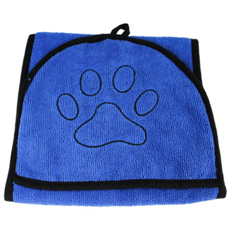 Pet absorbent dog bath towel in blue, green, and grey plain design drying a dog after bath