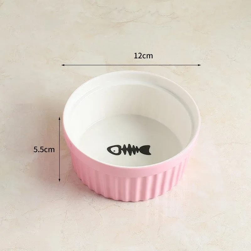 Raised ceramic cat food bowl with white fish bone pattern – protects pet cervical spine during feeding