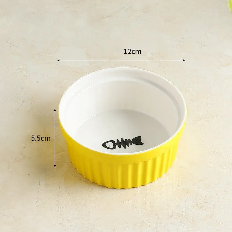 Raised ceramic cat food bowl with white fish bone pattern – protects pet cervical spine during feeding