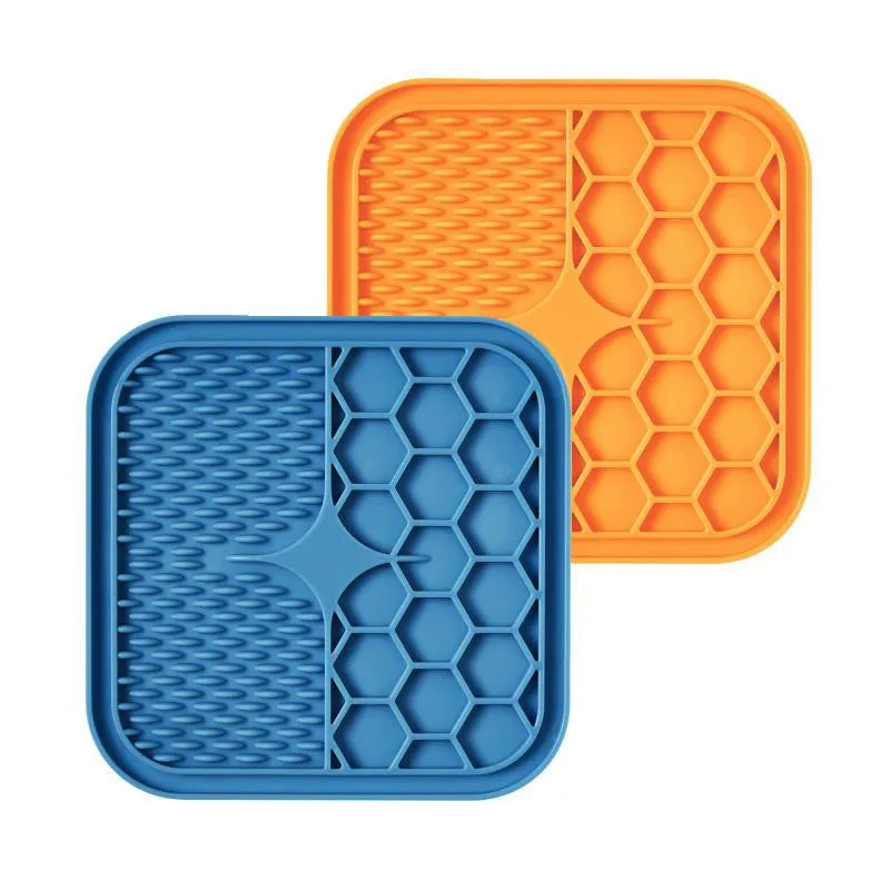 Silicone pet slow feeder licking pad in blue and orange with textured surface and scraper