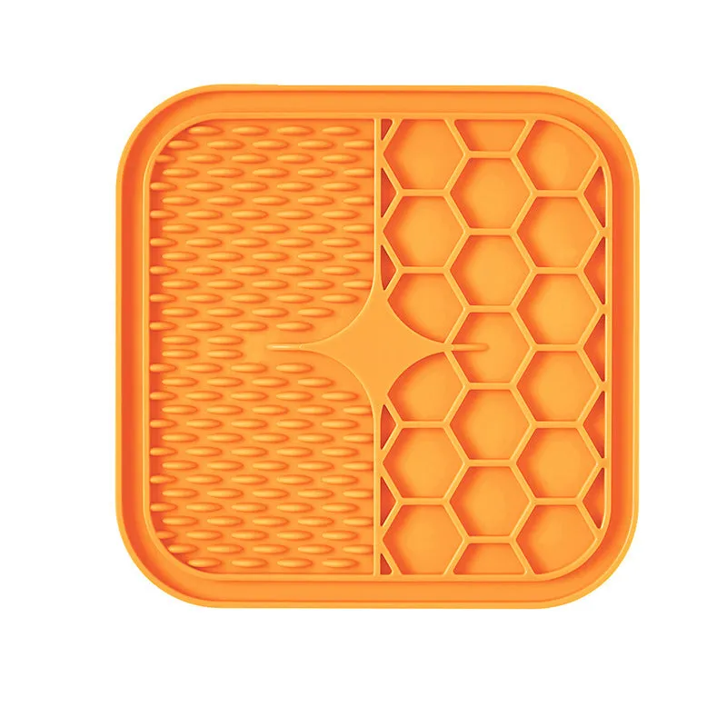 Silicone pet slow feeder licking pad in blue and orange with textured surface and scraper