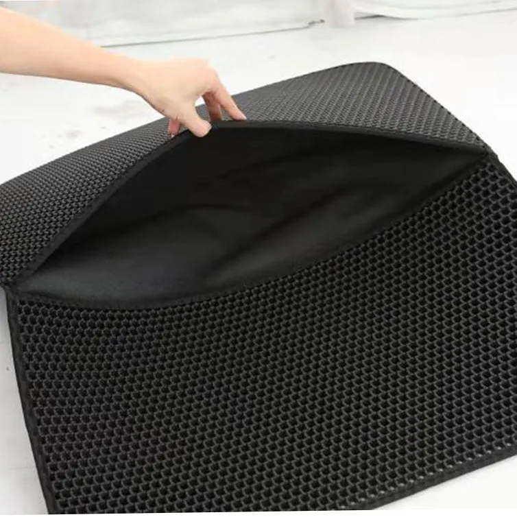 Double-layer EVA cat litter mat in black with honeycomb texture, 1.5cm thick, placed under a litter tray