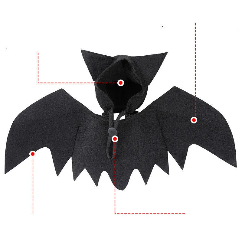 Black felt bat wing costume for cats and dogs with Velcro strap, size L shown on a pet