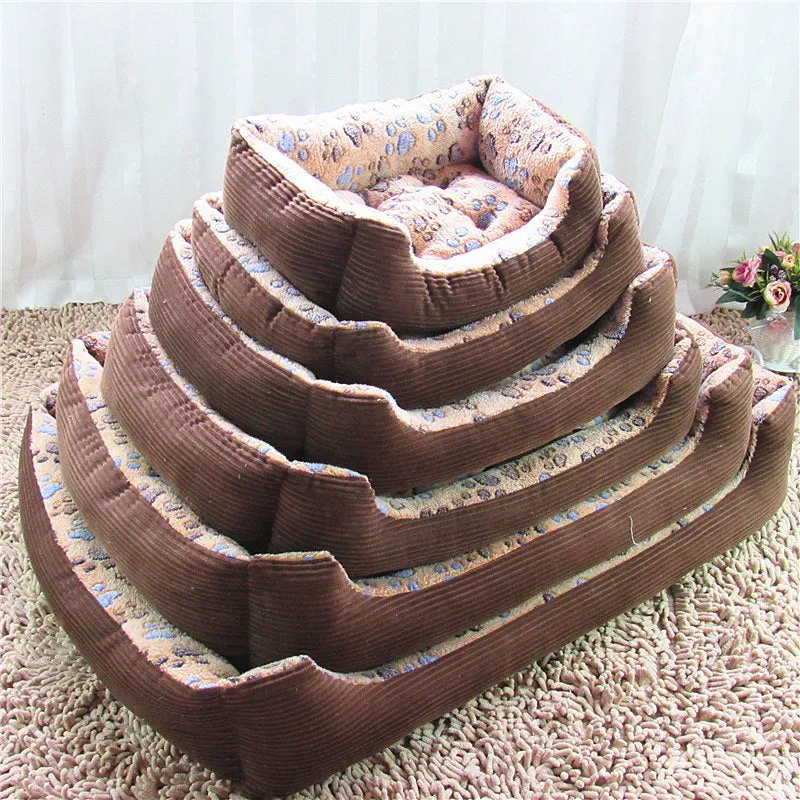 Beige sofa-style dog bed with plush fabric and raised bolsters for small dogs