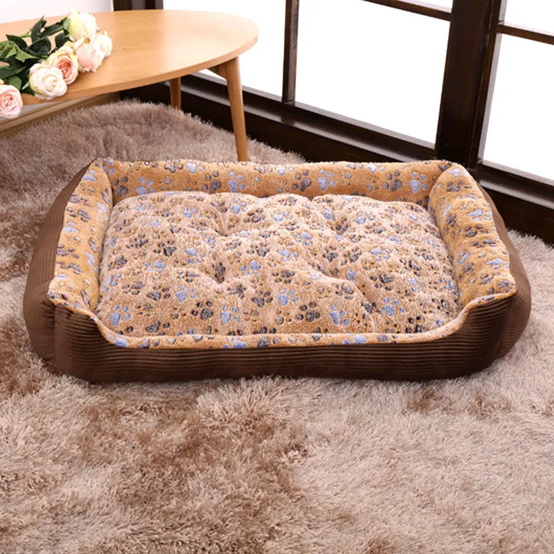 Beige sofa-style dog bed with plush fabric and raised bolsters for small dogs