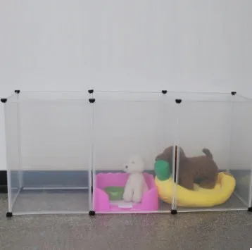 Pet transparent fence with six clear plastic panels arranged as a barrier on a wooden floor, showing interlocking connectors