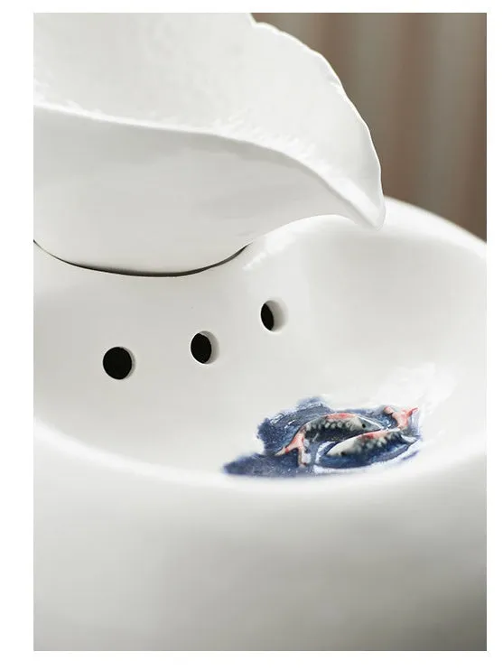 White porcelain leaf-shaped automatic cat water dispenser on floor